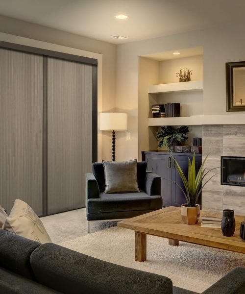 Beautiful modern living room interior with stone wall and firepl